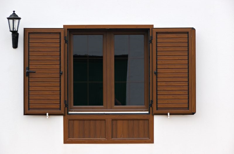 Hurricane-Protection-With-Colonial-Shutters-installation-services-Ferry Pass FL-storm-windows-with-colonial-shutters-mimic-wood Ferry Pass FL
